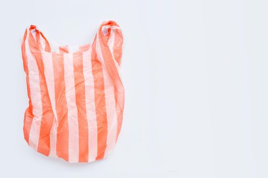 Colorful plastic bags on white background. Copy space