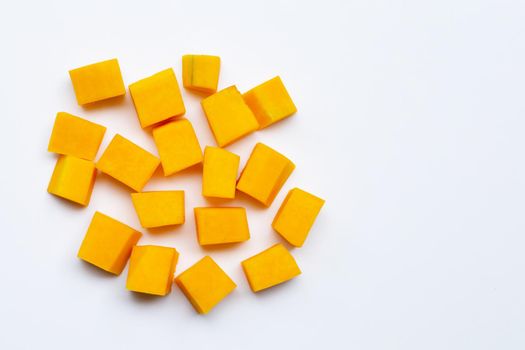 Cut and slices butternut squash on white background.