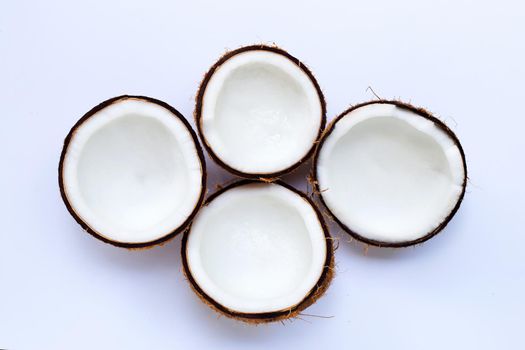 Half coconuts on white background. Top view