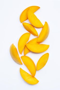Tropical fruit, Mango slices on white background. Top view