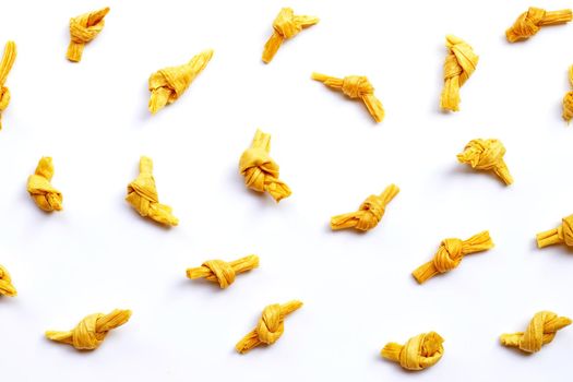 Dried bean curd knot on white background. Top view