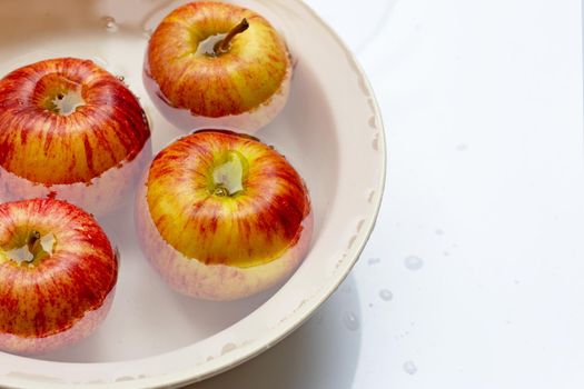 Washing fresh apples in the water