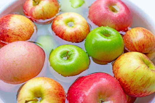 Washing fresh apples in the water