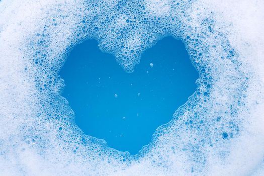 Frame made of detergent foam bubble. Heart shape