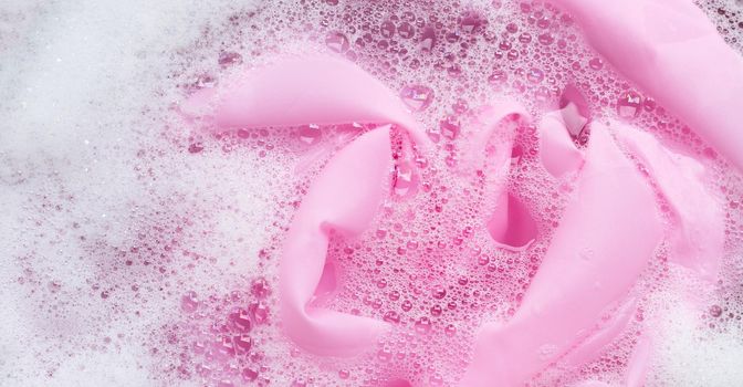 Color clothes soak in powder detergent water dissolution. Laundry concept