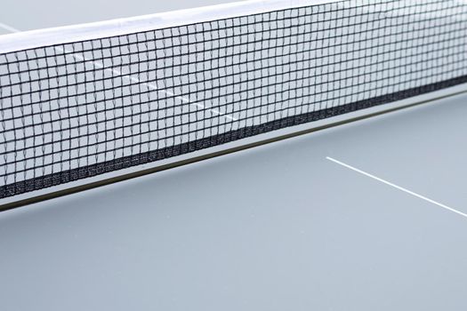 Net of table tennis ping pong on grey background