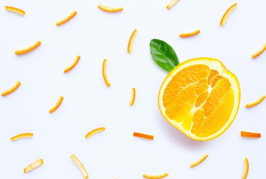 Orange peels slices on white background. top view