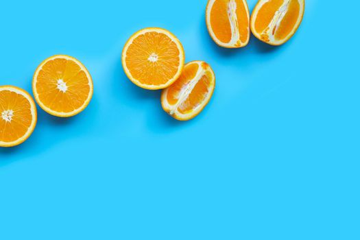 High vitamin C, Juicy and sweet. Fresh orange fruit  on blue background. Top view