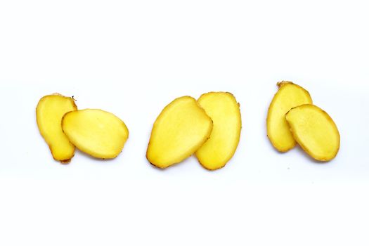 Ginger slices on white background.