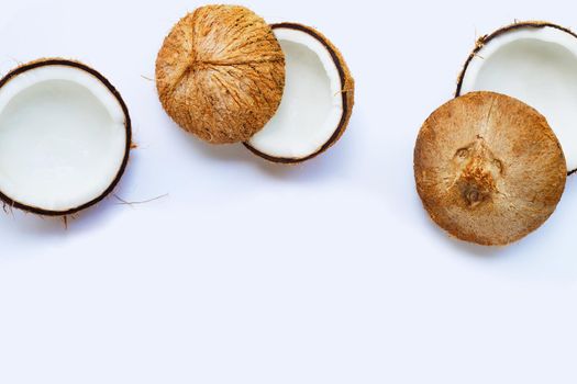 Half coconuts on white background. Copy space
