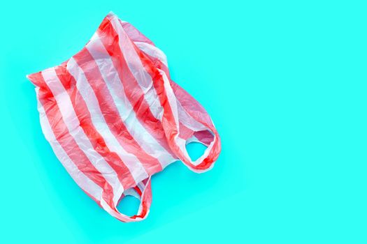 Colorful plastic bags on white background. Copy space