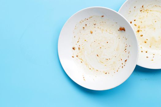 Dirty dishes on blue background. Top view