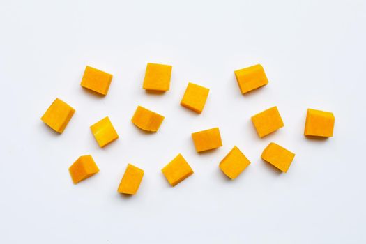 Cut and slices butternut squash on white background.