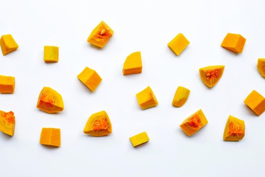 Cut and slices butternut squash on white background.