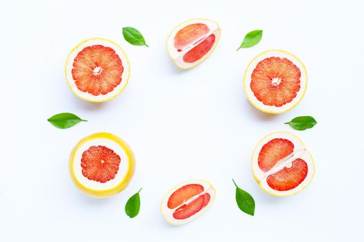High vitamin C. Frame made of Juicy grapefruit on white background.