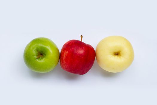 Juicy red, yellow and green apples on white background.