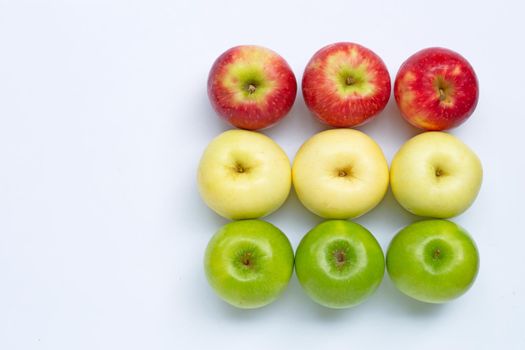 Juicy red, yellow and green apples on white background.