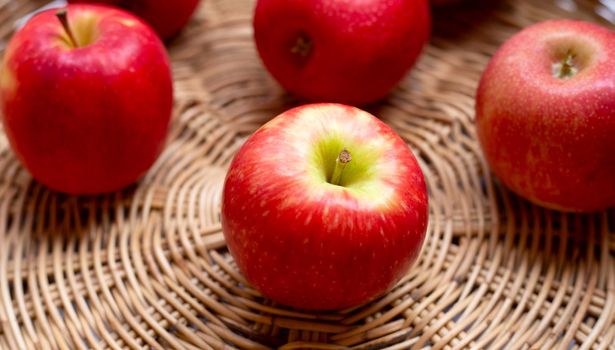 Juicy red apples in a basket