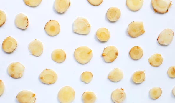 Fresh galangal  slices on white background. Top view