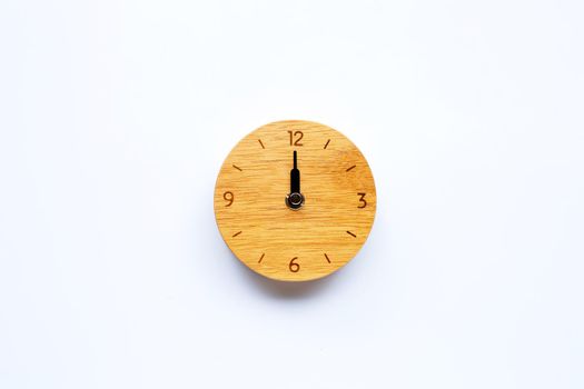 Wooden clock on white background. Copy space