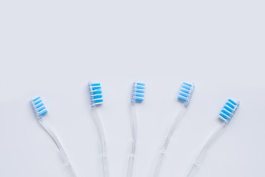 Toothbrushes on white background. Top view