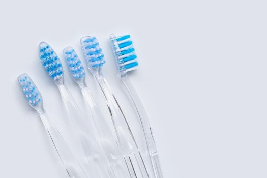 Toothbrushes on white background. Top view