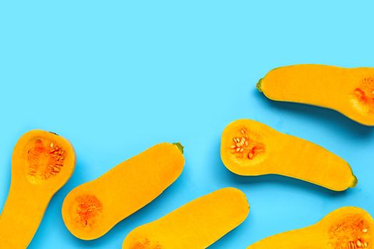 Butternut squash on blue background. Copy space