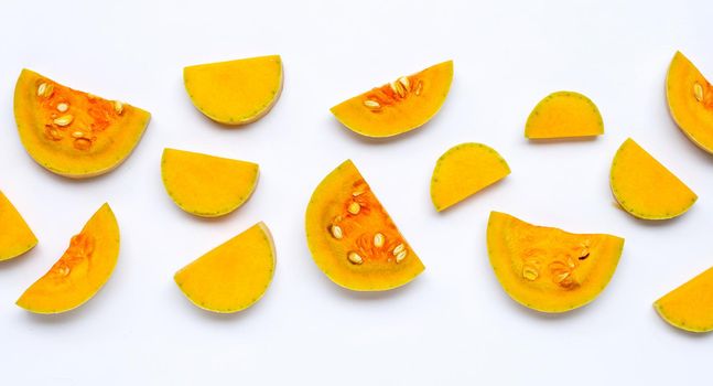 Cut and slices butternut squash on white background.