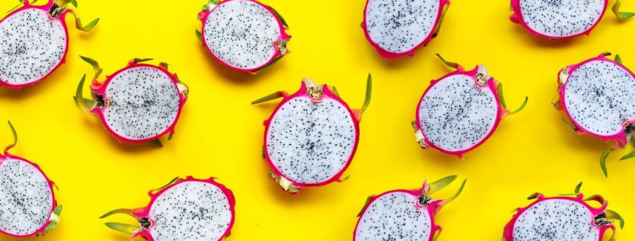 Dragon fruit or pitaya on yellow background. Delicious tropical exotic fruit. Top view