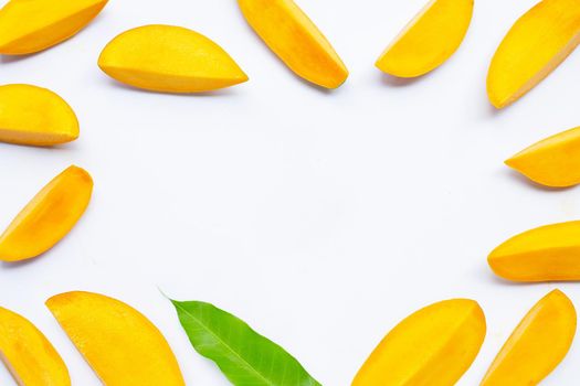 Tropical fruit, Frame made of mango  slices on white background. Top view