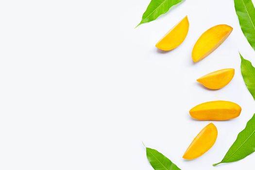 Tropical fruit, Mango  slices with leaves on white background. Top view
