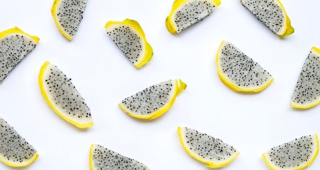 Yellow pitahaya or dragon fruit slices on white background. Copy space