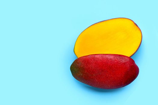 Tropical fruit, Mango on blue background. Top view