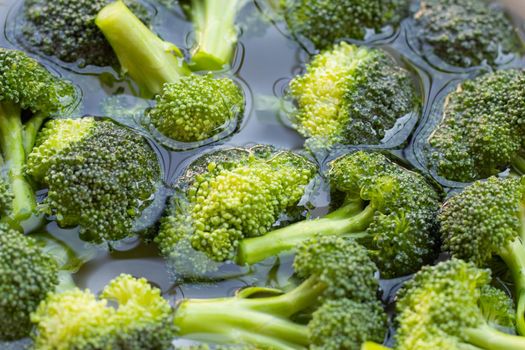 Fresh broccoli soaked in water