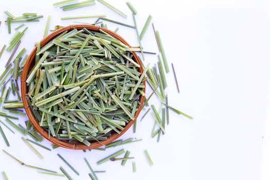 Organic lemongrass leaves on white background.