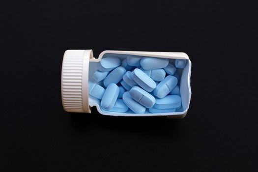 "PrEP" ( Pre-Exposure Prophylaxis). used to prevent HIV. Dark bakcground. Copy space