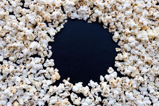 Popcorn on dark background. Copy space
