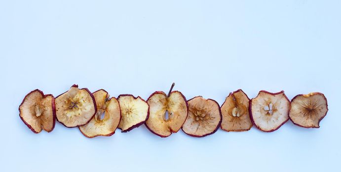 Dried apple slices on white background