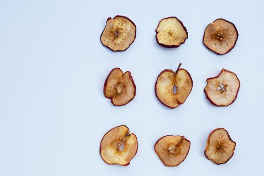 Dried apple slices on white background