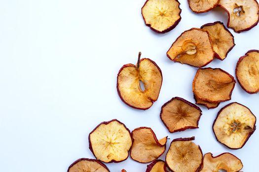 Dried apple slices on white background