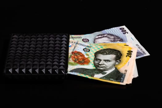 LEI romanian money banknotes in black wallet isolated