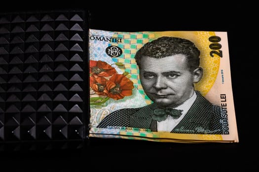 LEI romanian money banknotes in black wallet isolated