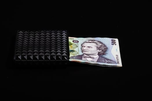 LEI romanian money banknotes in black wallet isolated