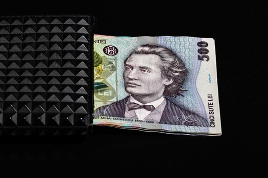 LEI romanian money banknotes in black wallet isolated