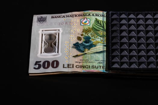 LEI romanian money banknotes in black wallet isolated