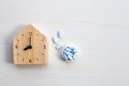 Clock with "PrEP" ( Pre-Exposure Prophylaxis). used to prevent HIV on table background. Copy space