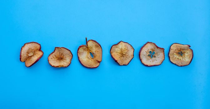 Dried apple slices on white background