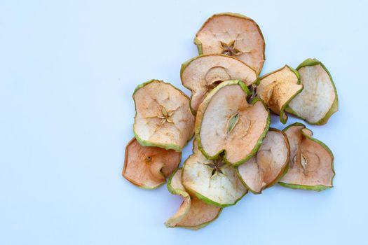 Dried apple slices on white background