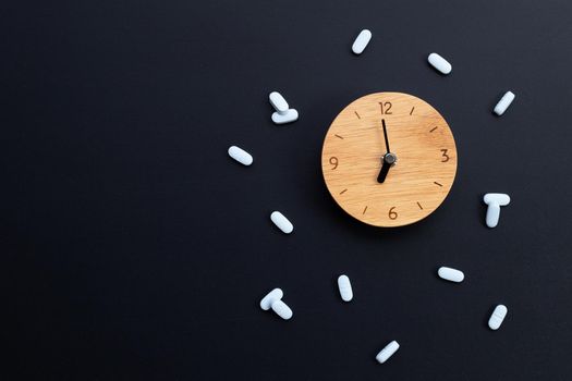 Clock with "PrEP" ( Pre-Exposure Prophylaxis). used to prevent HIV on dark background. Copy space