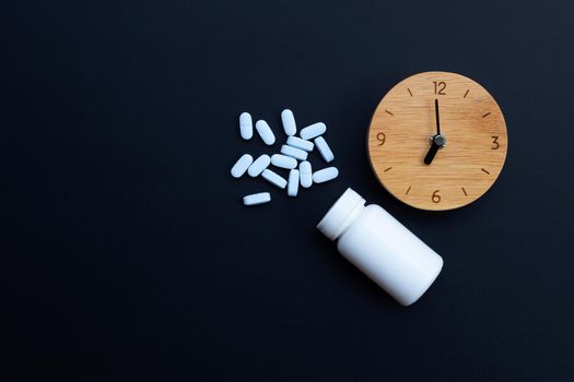 Clock with "PrEP" ( Pre-Exposure Prophylaxis). used to prevent HIV on dark background. Copy space